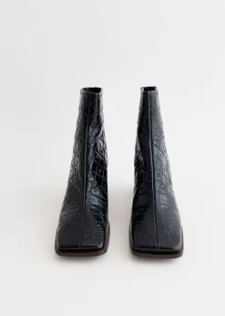 Moonogram Embossed Leather Block Boots